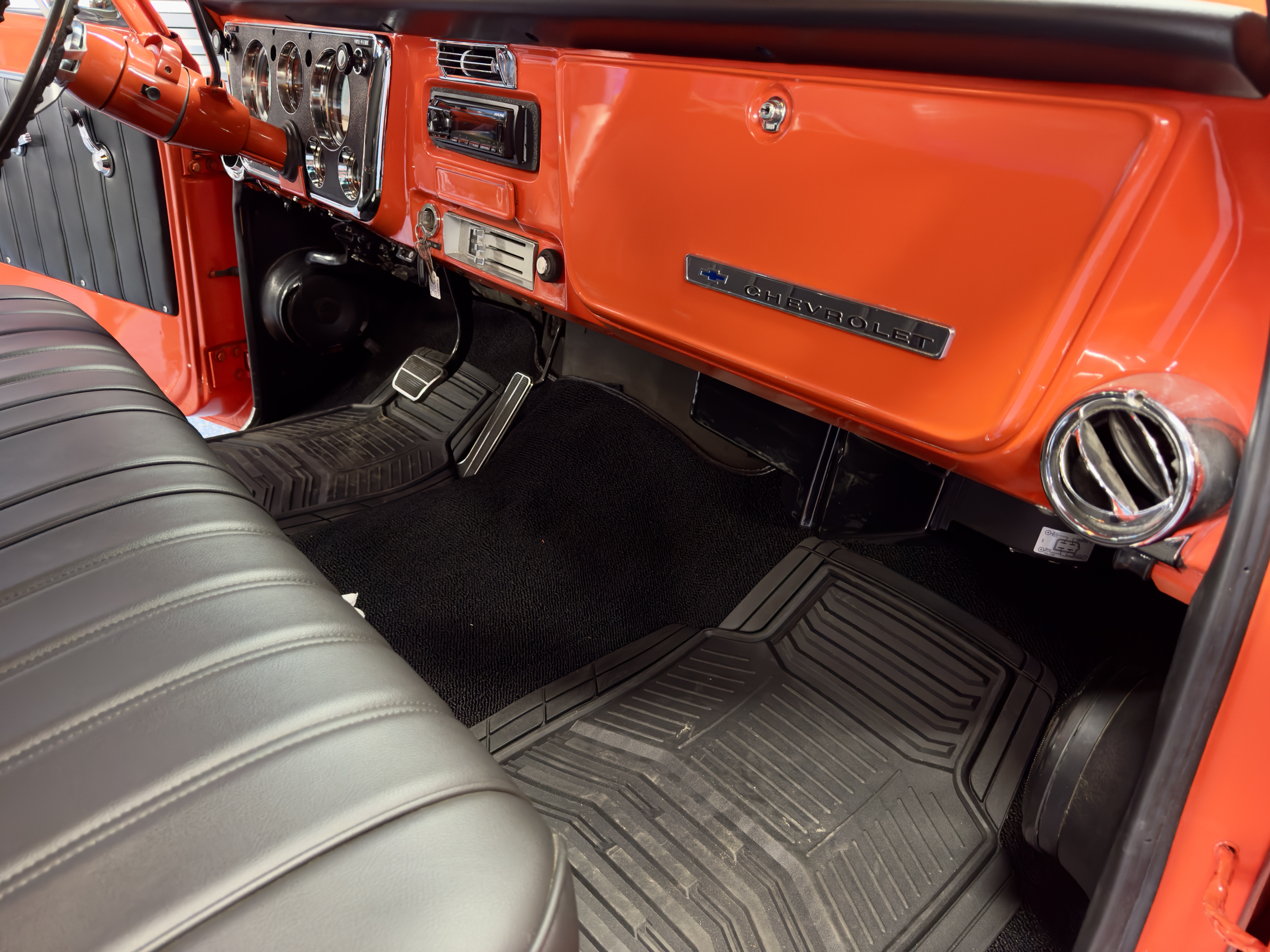 Classic orange Chevy interior with hidden speaker integration
