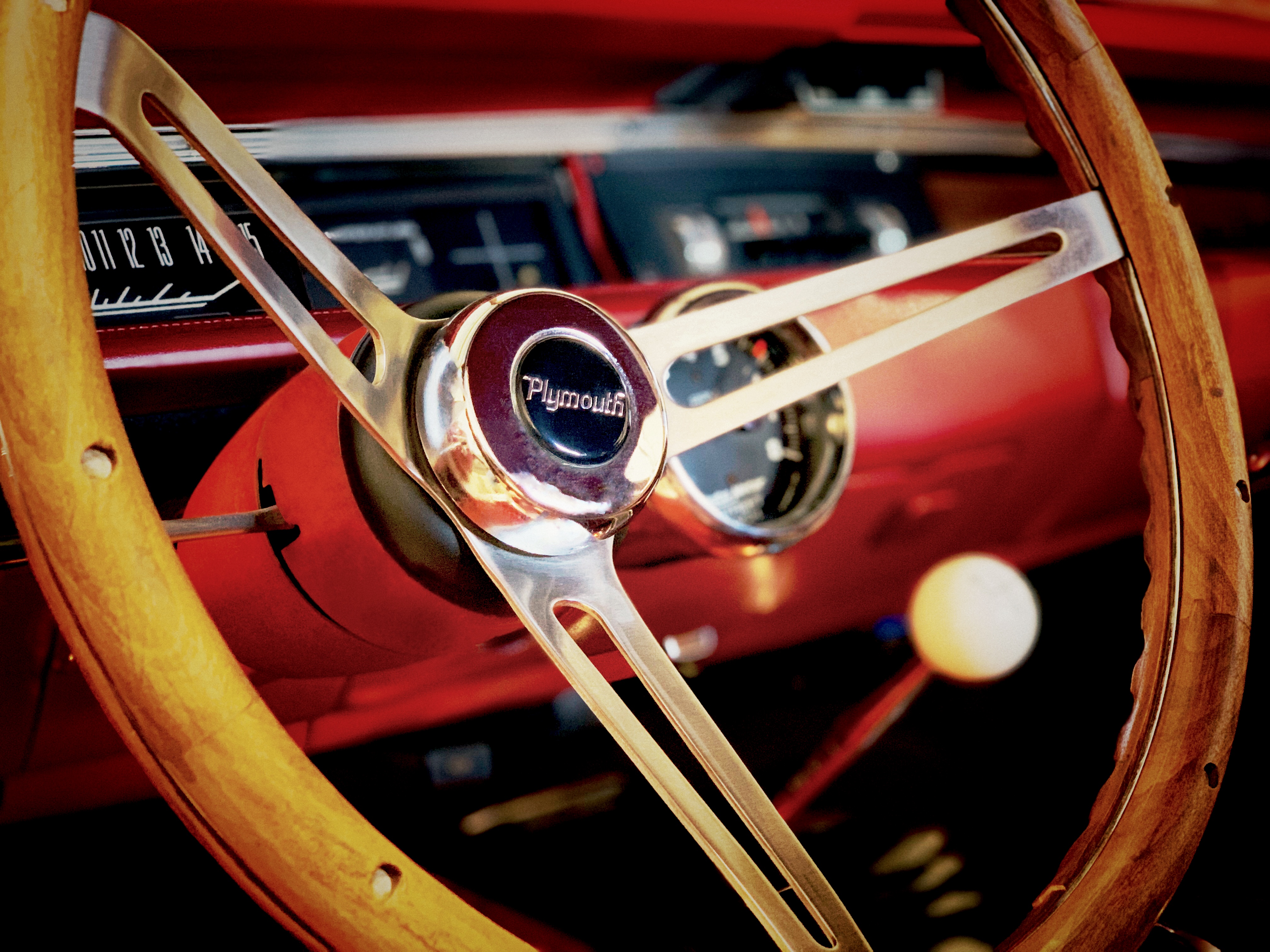 Classic Plymouth steering wheel and dash close-up